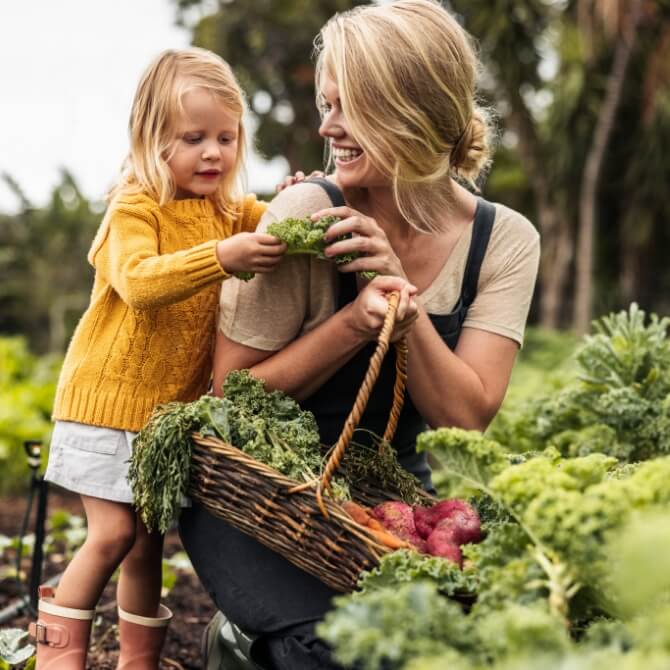 Image showing a mother and daughter picking vegetables