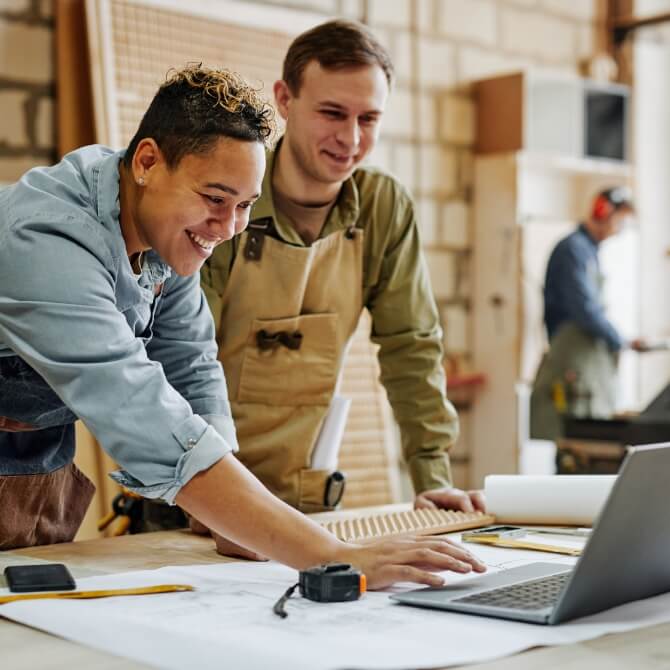 Image showing team members looking at a laptop