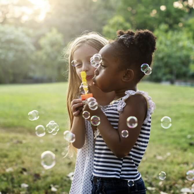 Image showing little girls blowing bubbles