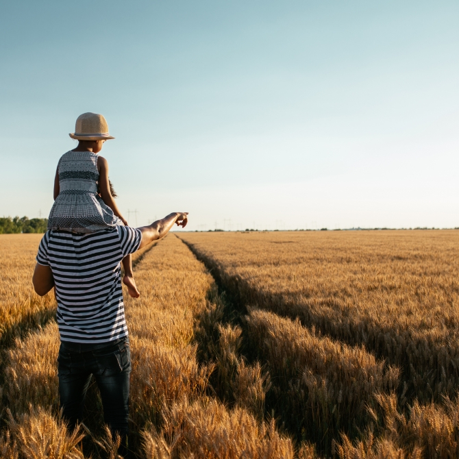 Image showing a father and daughter in a field together