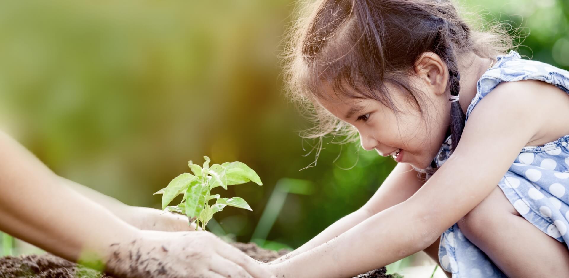 Image showing a little girl planting