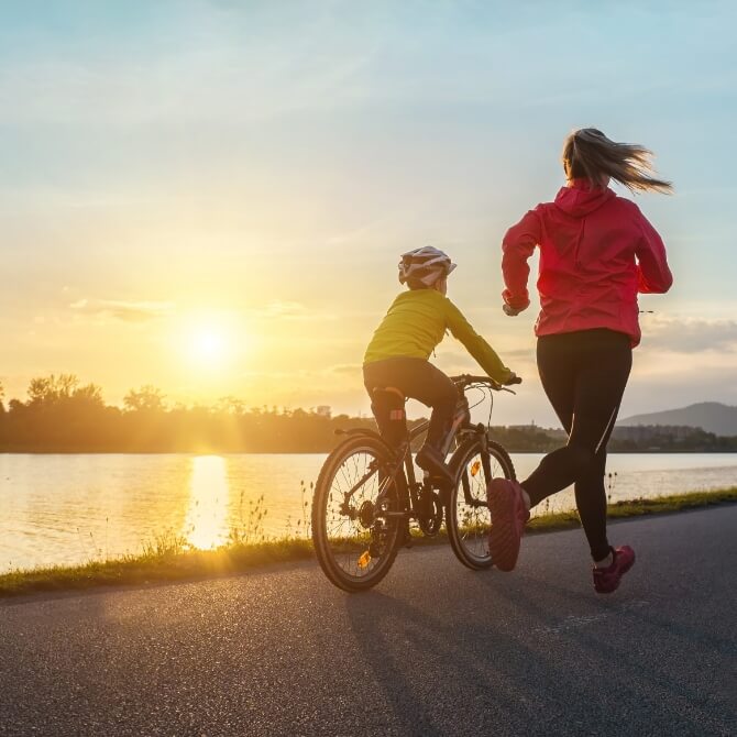 Image showing a mother and son in a park at sunset