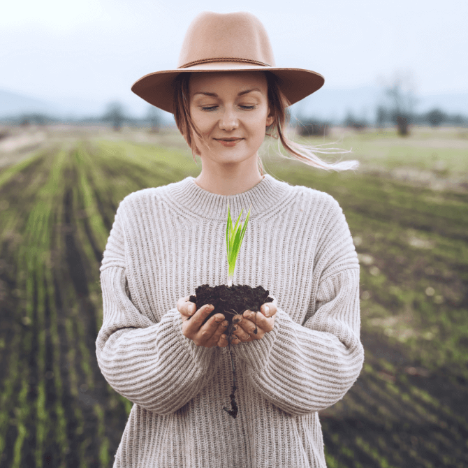 Image showing a woman holding a plant